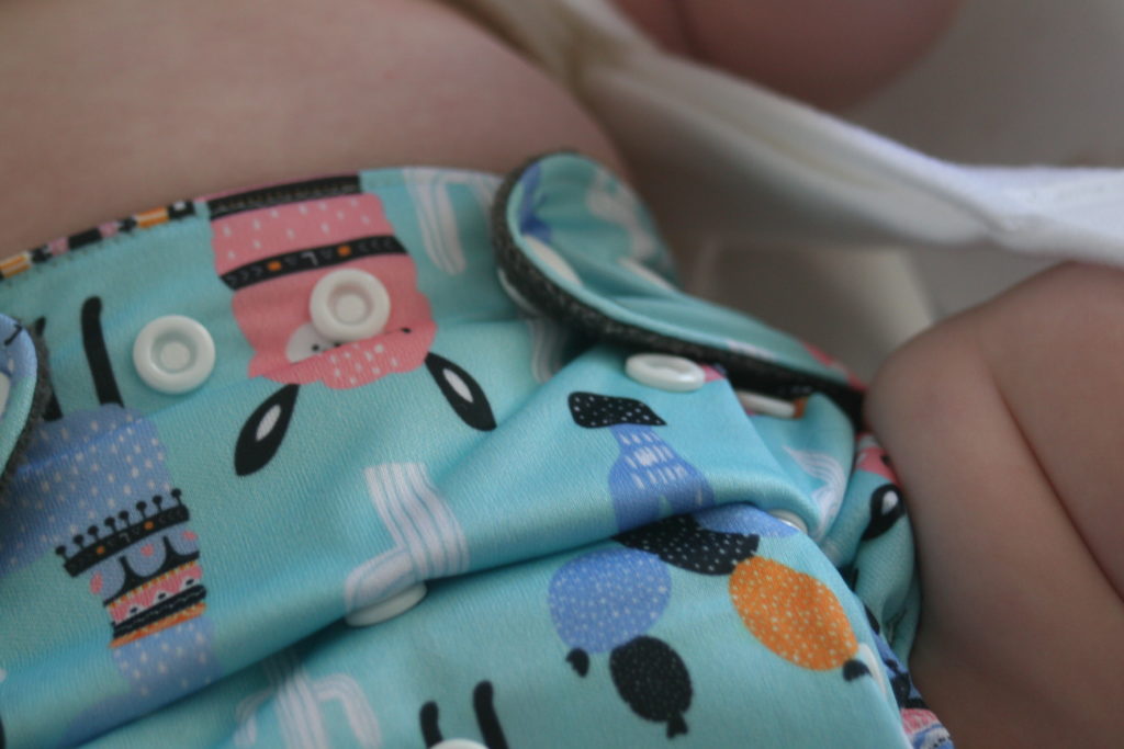 how to change a diaper with a pavlik harness image of where the straps go